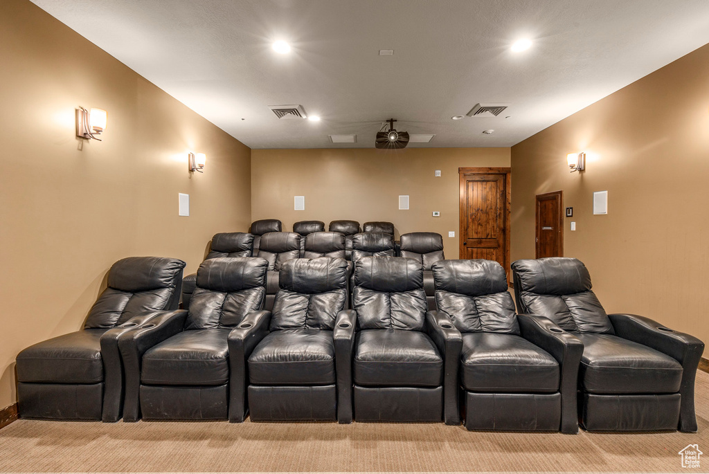 Home theater featuring light carpet and recessed lighting