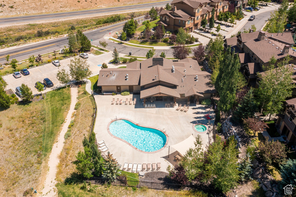 Aerial view of residential area featuring a pool