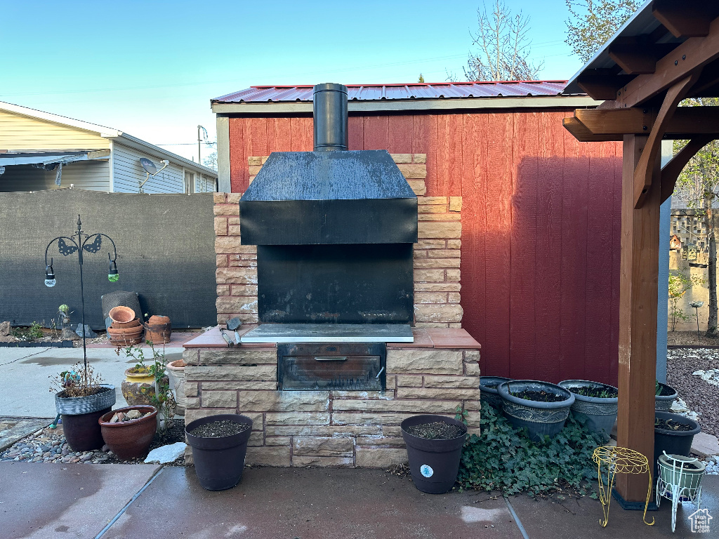 View of patio / terrace featuring a fireplace