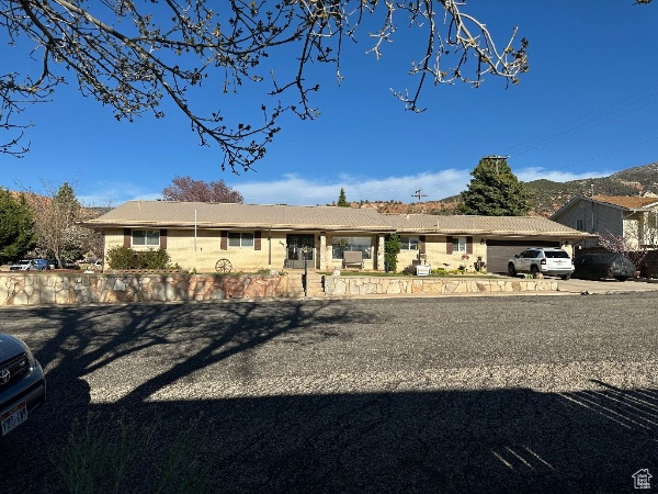 View of front of property with a tile roof