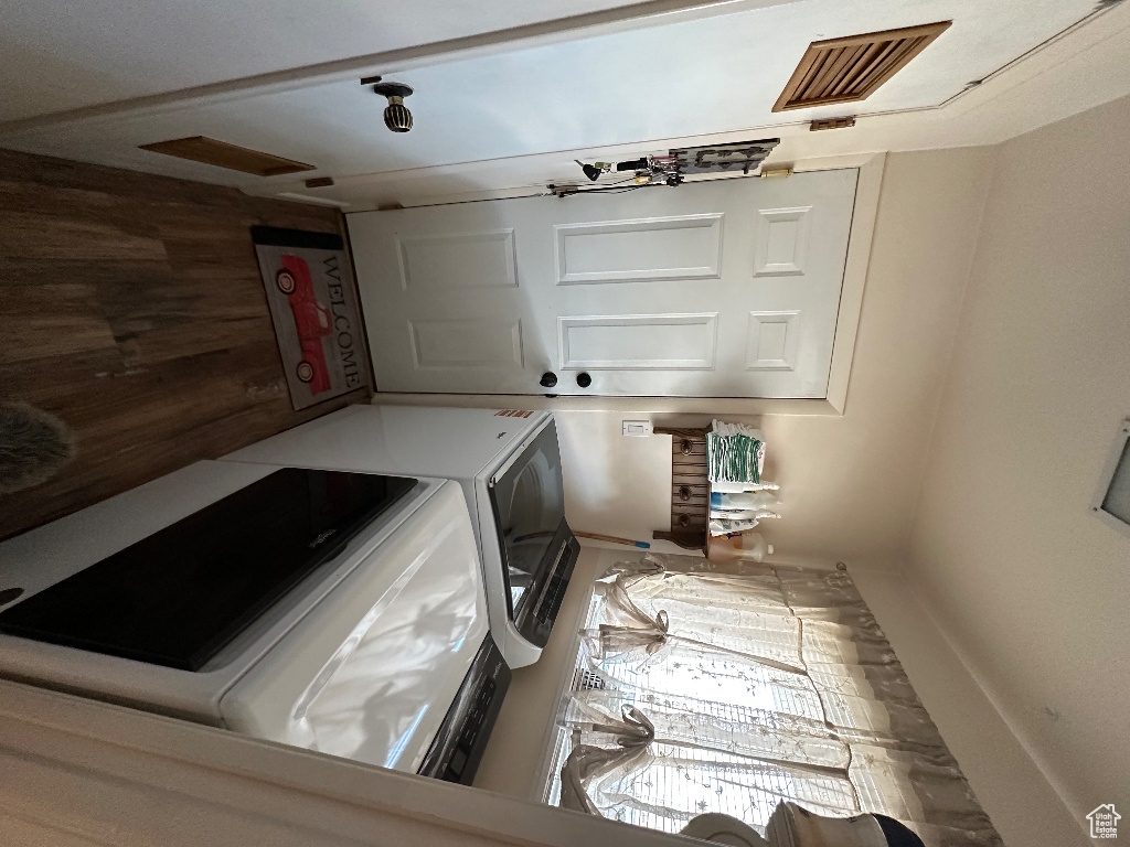 Laundry area featuring visible vents, washer and dryer, and laundry area