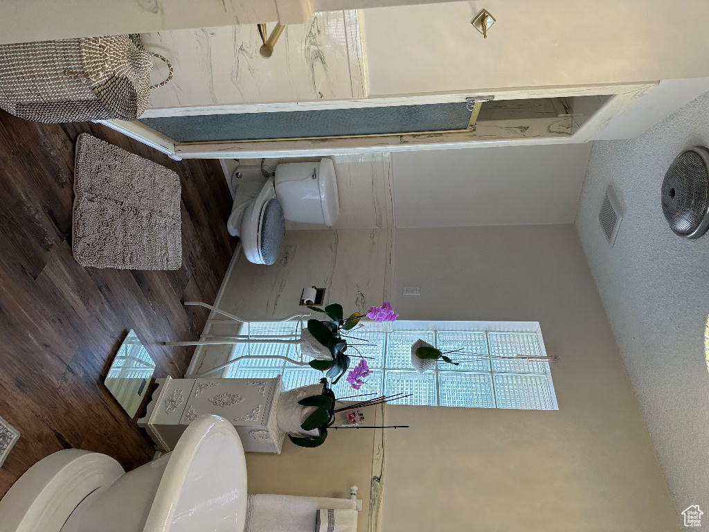 Bathroom with toilet and visible vents