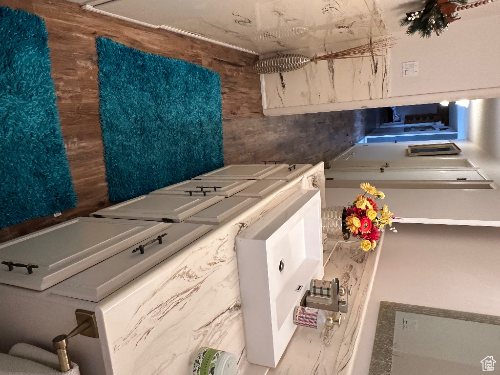 Washroom with washing machine and dryer and laundry area