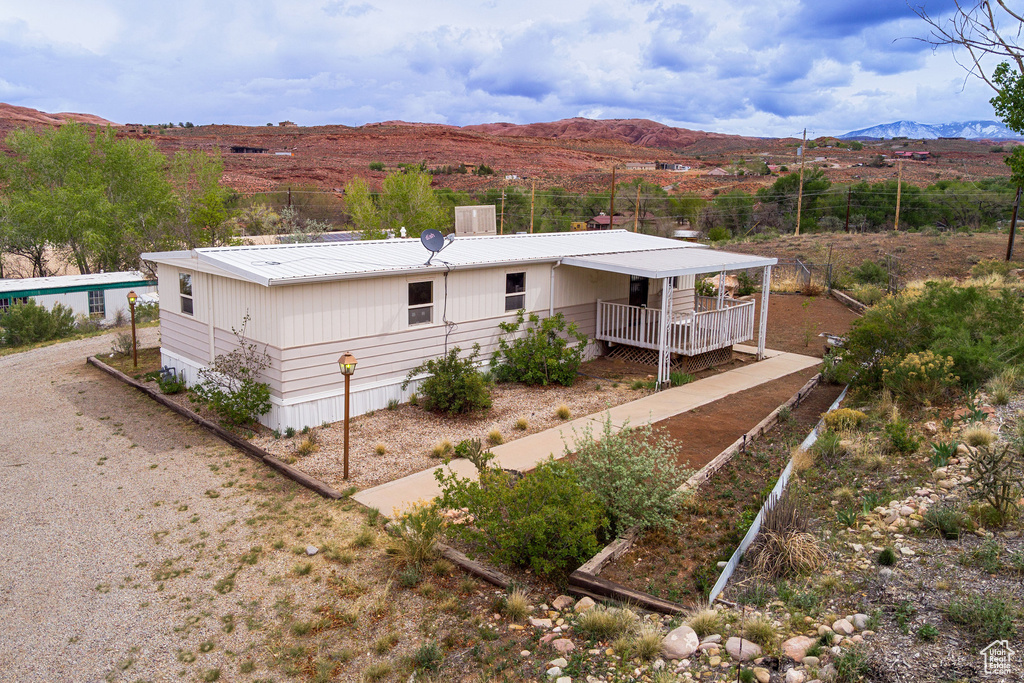 Rear view of house with a mountain view and metal roof
