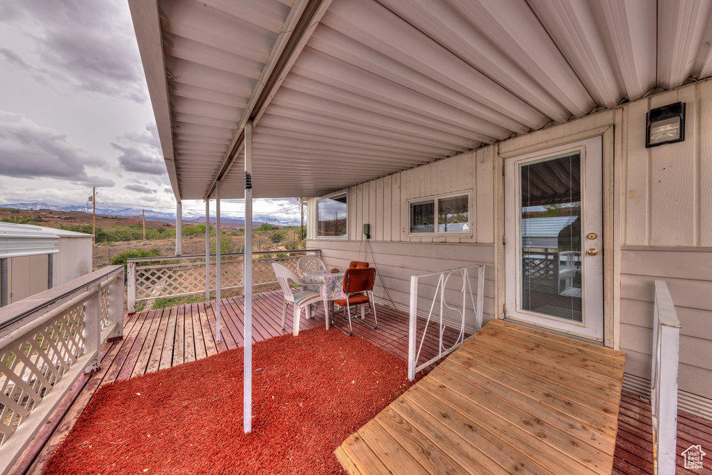 Wooden deck featuring a mountain view