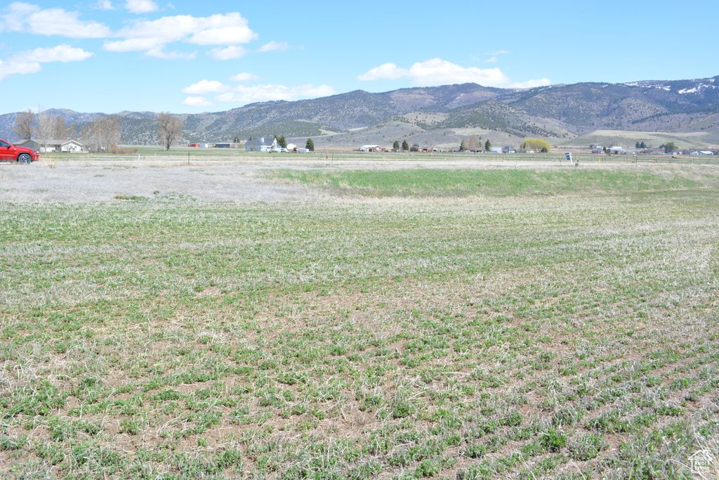 Property view of mountains with a rural view