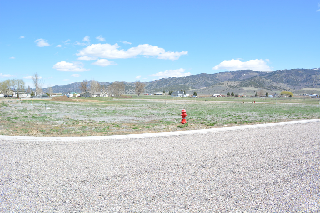 Property view of mountains with a rural view