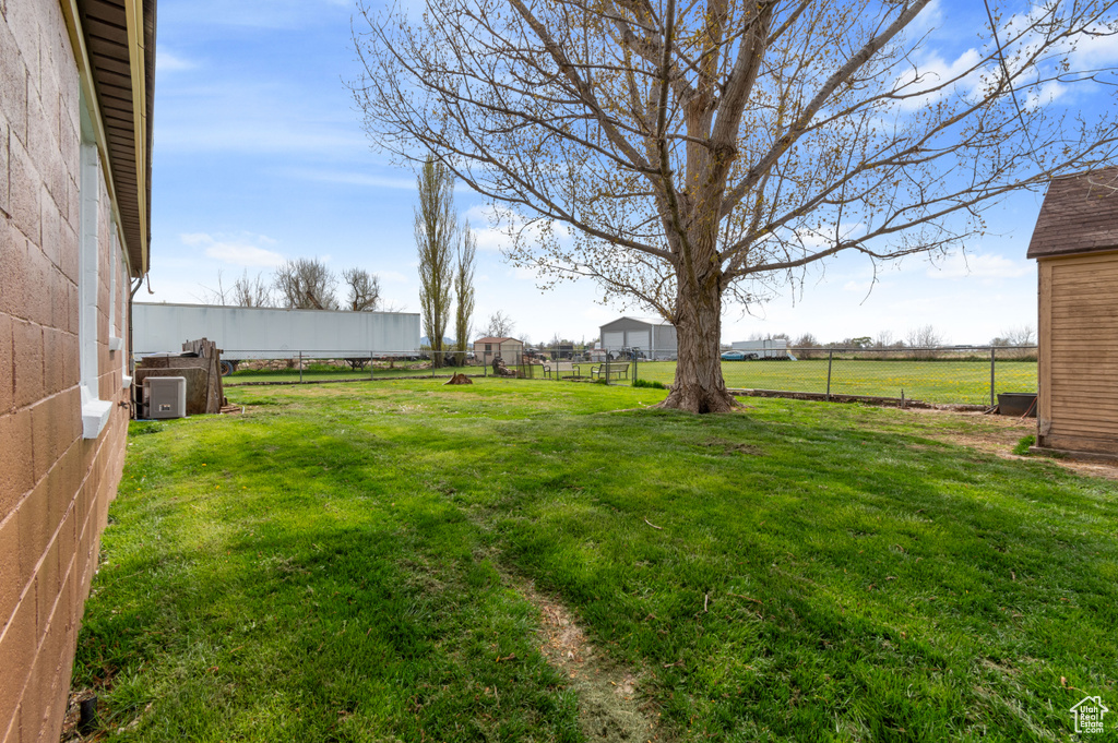 View of yard featuring fence