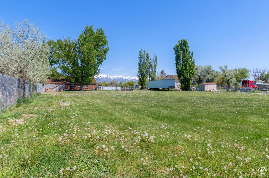 View of yard featuring fence