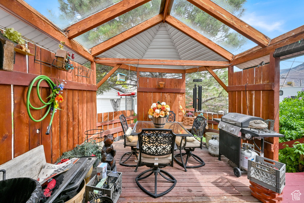 Exterior space featuring a skylight and beamed ceiling