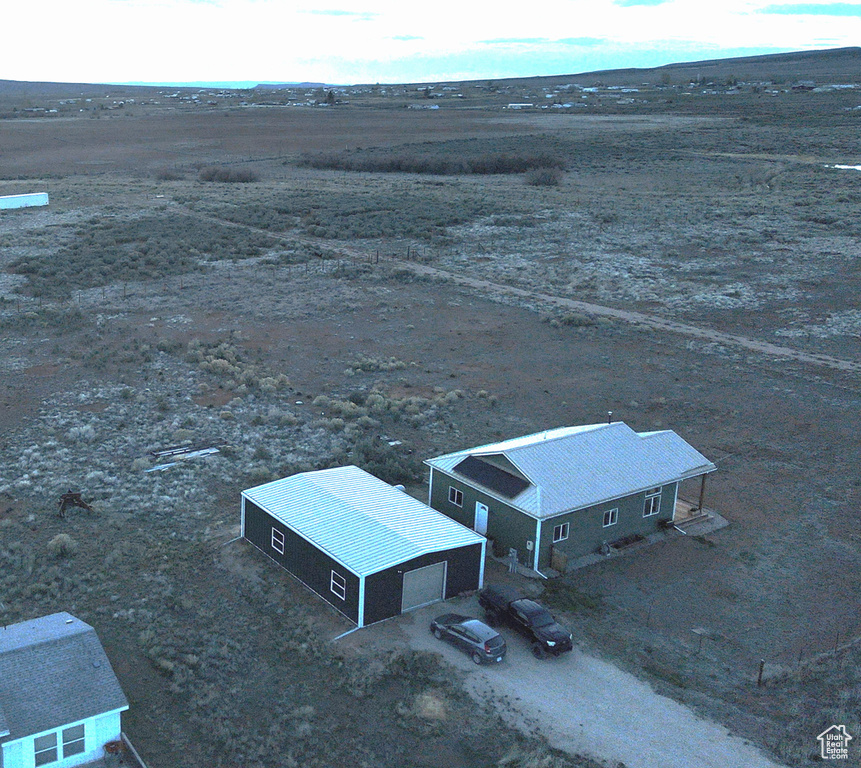 Birds eye view of property with a rural view