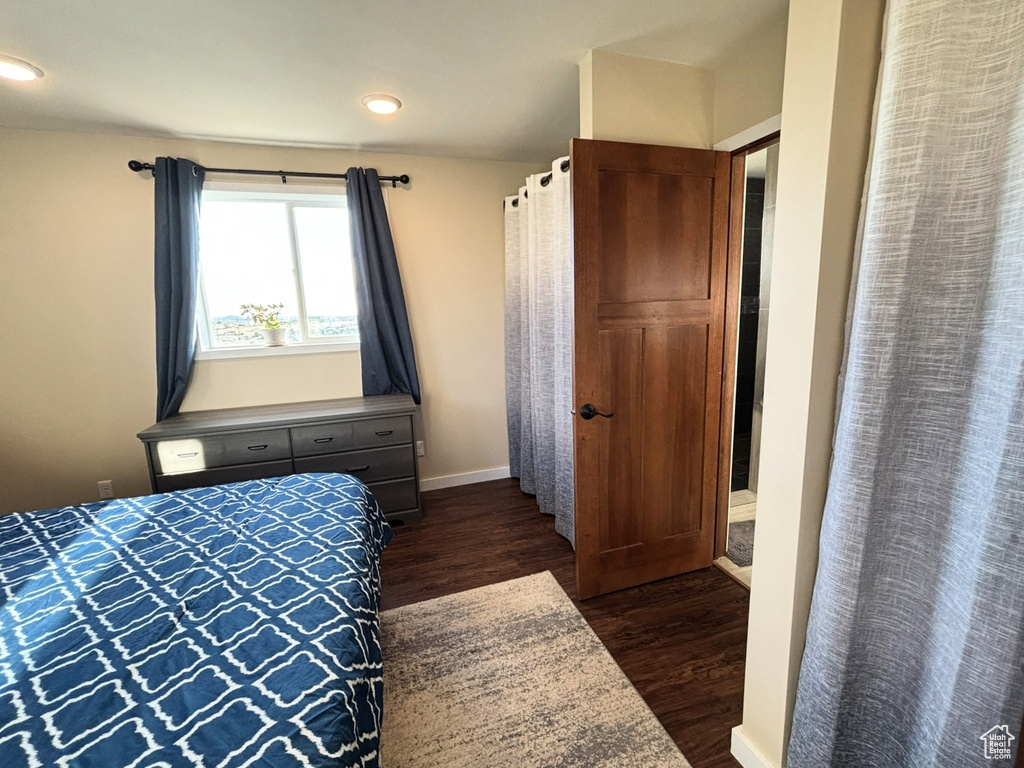 Bedroom featuring recessed lighting, baseboards, and dark wood finished floors