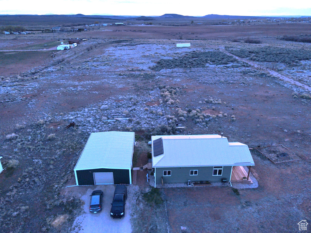 Birds eye view of property featuring a mountain view and a desert view