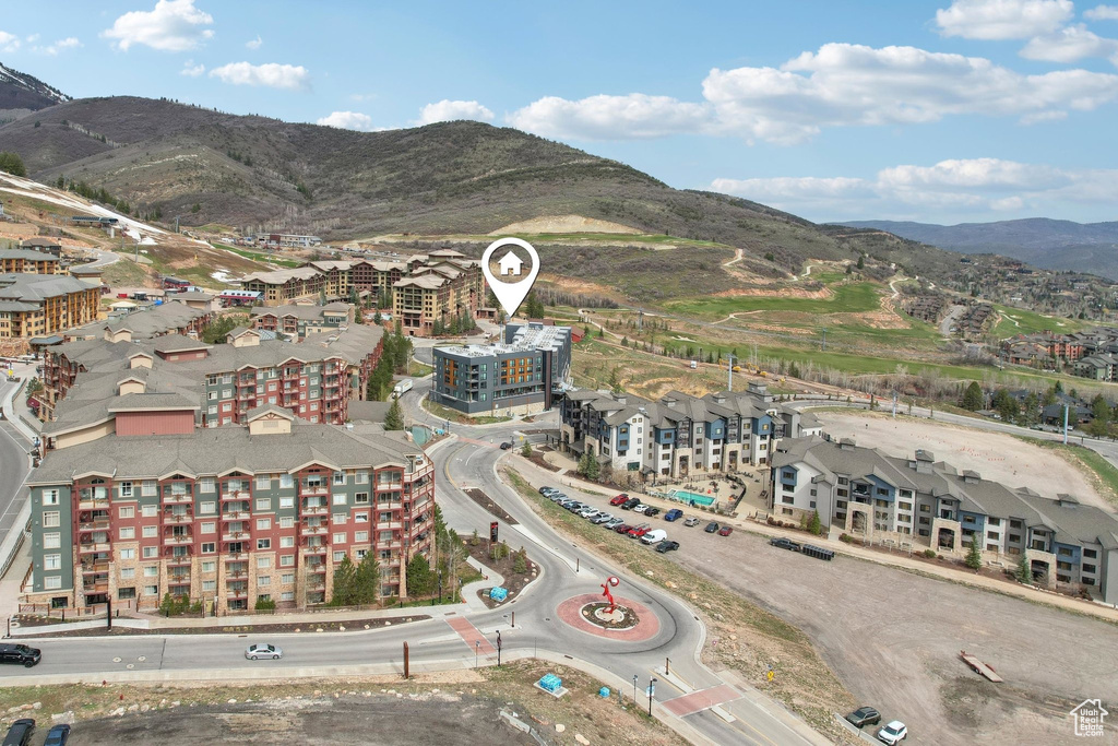 Birds eye view of property with a mountain view