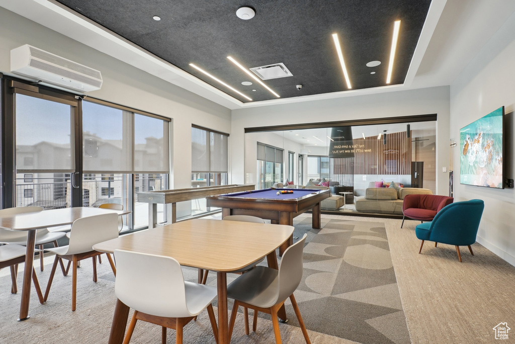 Rec room with a healthy amount of sunlight, a wall unit AC, visible vents, and pool table