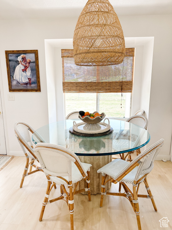 Dining area featuring light wood finished floors and baseboards