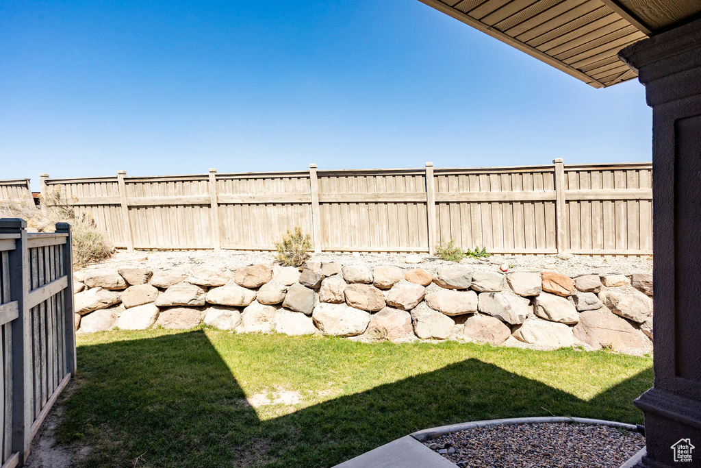 View of yard featuring a fenced backyard