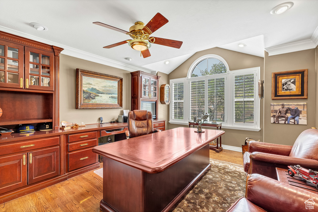 Home office with recessed lighting, ceiling fan, vaulted ceiling, and light wood-style flooring