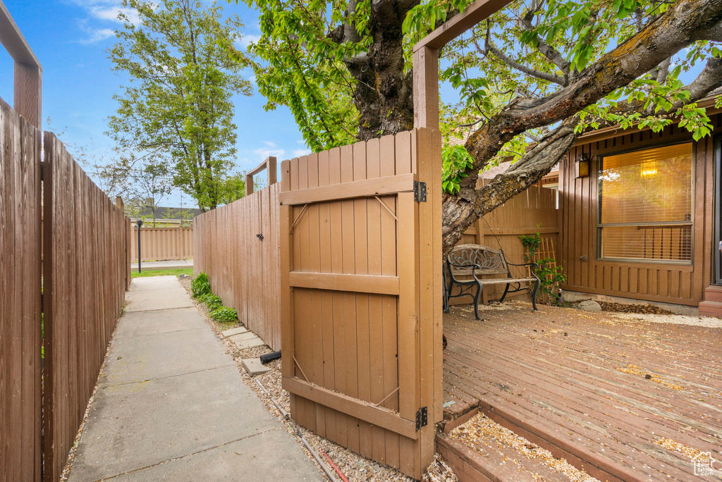 Exterior space with a gate and a fenced backyard