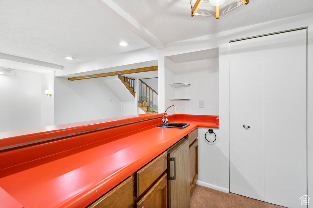 Bar with a sink, stairway, recessed lighting, indoor wet bar, and light carpet