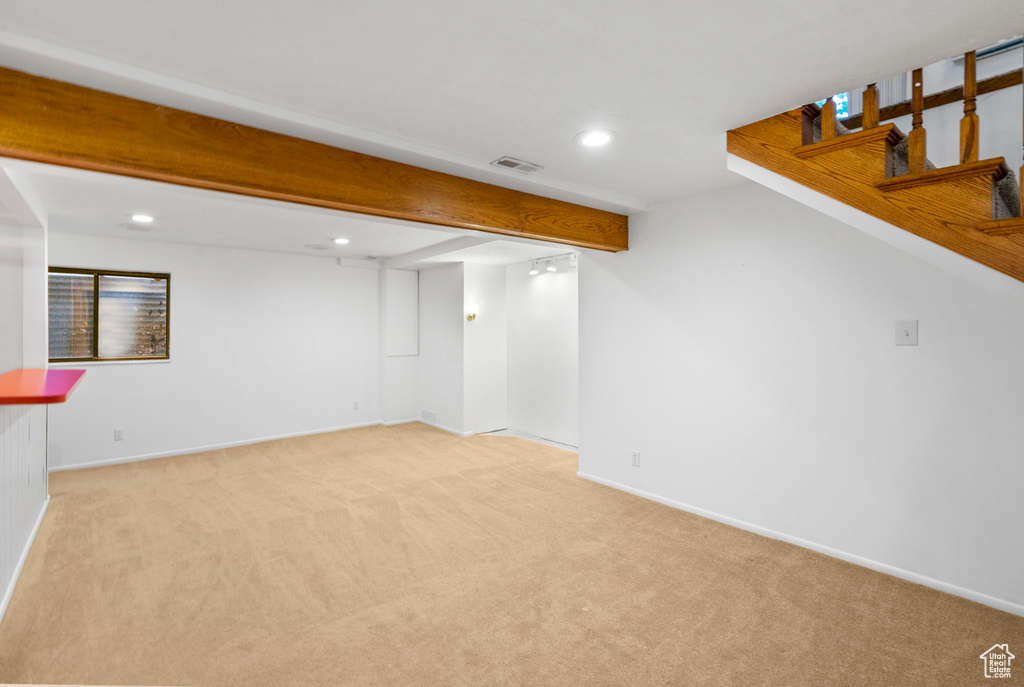 Finished basement with recessed lighting, visible vents, light carpet, and baseboards
