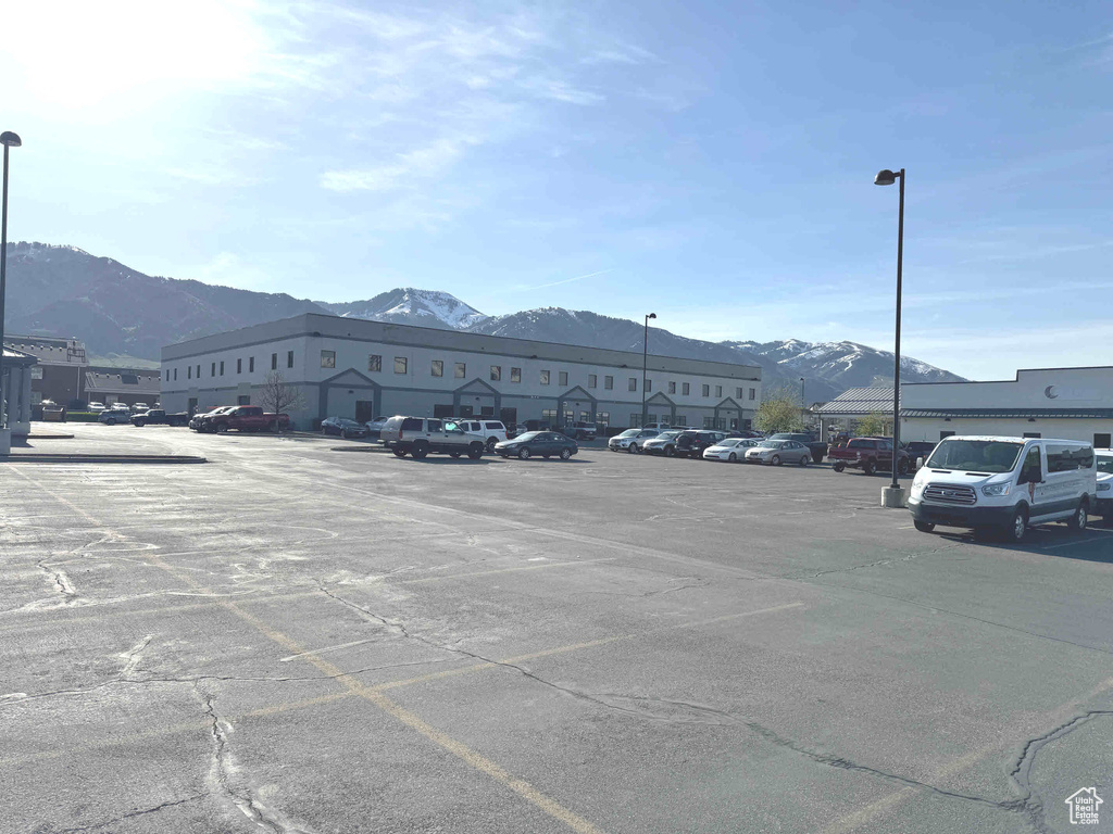 Uncovered parking lot featuring a mountain view