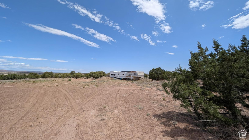 View of yard with a rural view