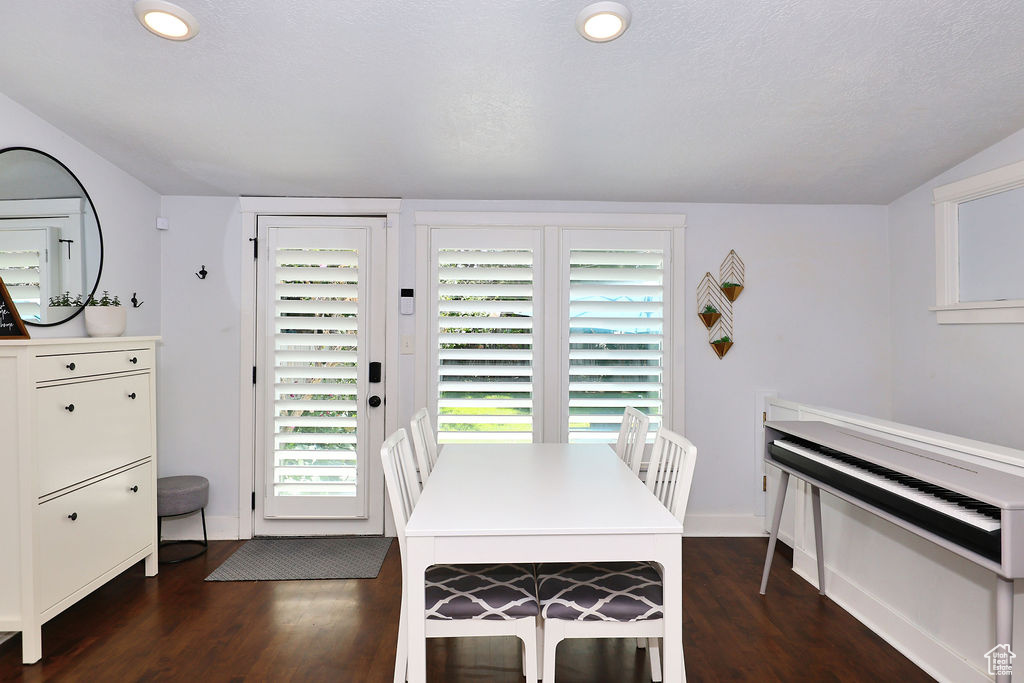 Dining area featuring recessed lighting, baseboards, and dark wood finished floors