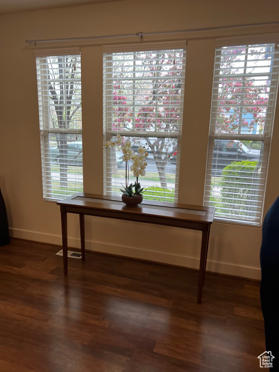 Room details featuring baseboards and wood finished floors