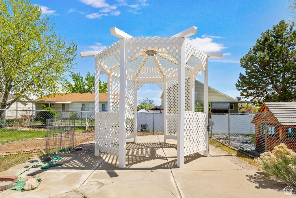 View of patio featuring a gazebo and fence