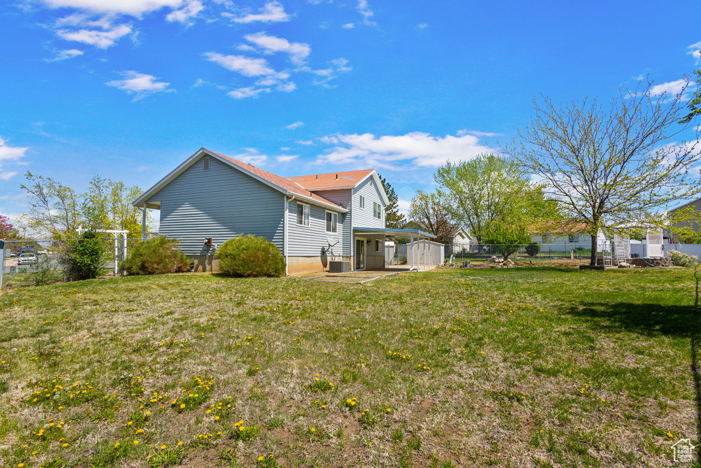 View of yard featuring fence