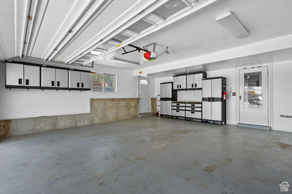 Garage featuring a garage door opener