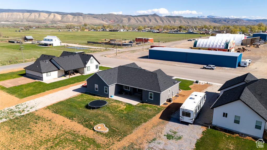 Birds eye view of property with a mountain view