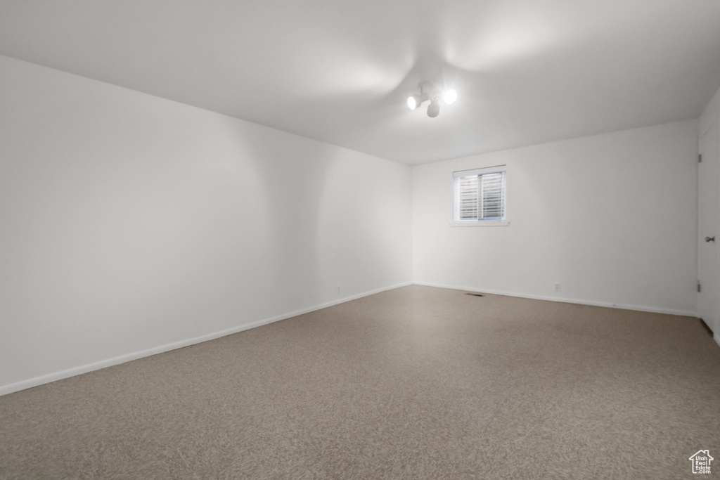 Unfurnished room with baseboards