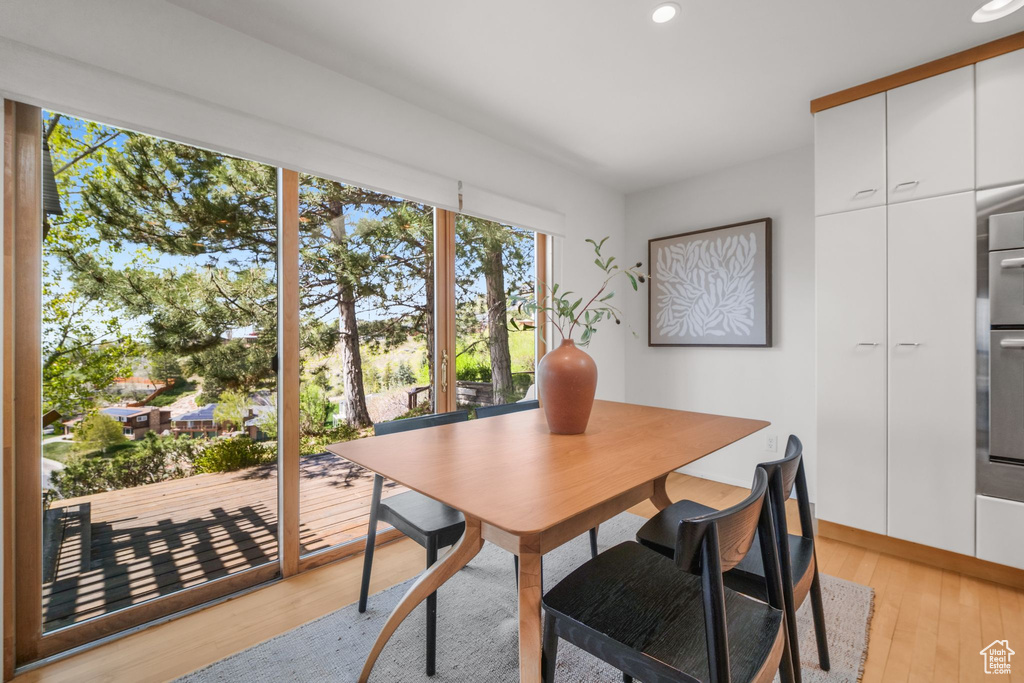 Dining area featuring recessed lighting and light wood-style flooring