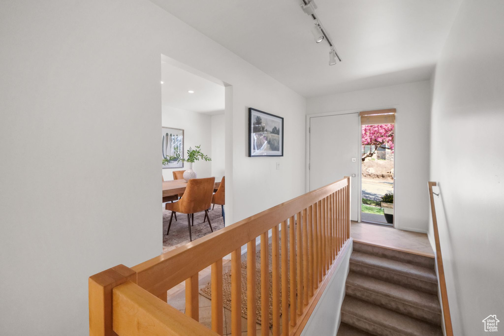 Stairway with rail lighting and baseboards