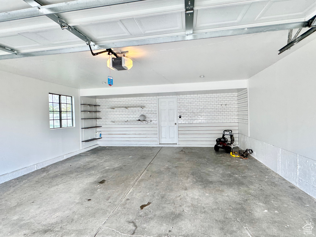Garage featuring a garage door opener