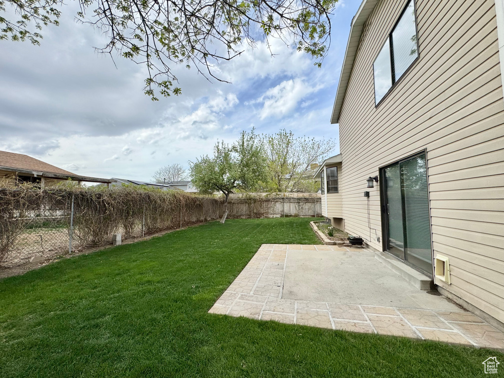 View of yard with a patio and a fenced backyard