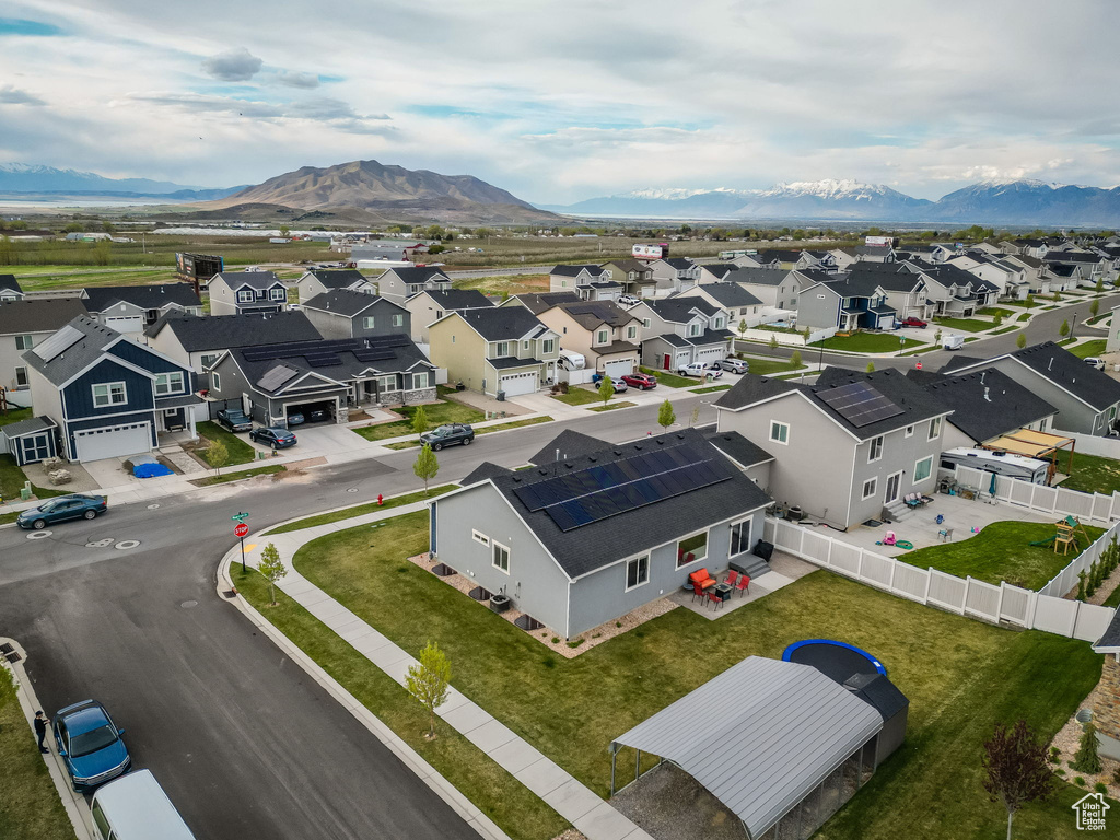 Birds eye view of property with a residential view and a mountain view