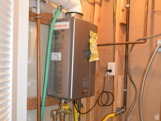 Utility room featuring water heater