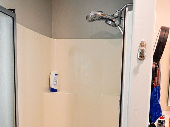 Full bathroom with a shower stall
