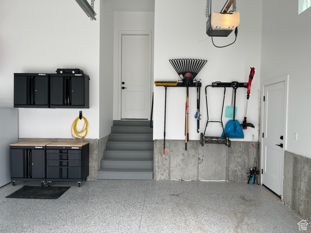 Garage featuring a garage door opener