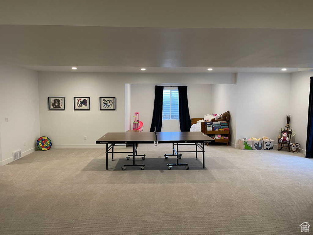 Rec room featuring baseboards, recessed lighting, and light colored carpet