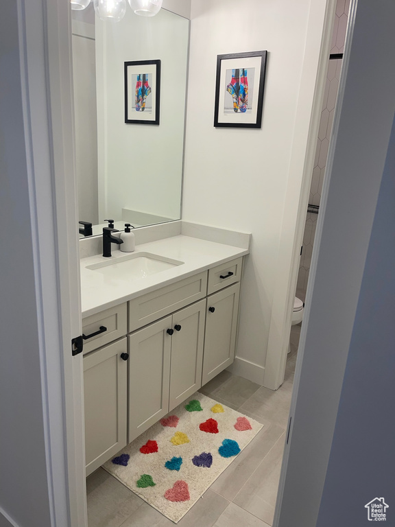 Bathroom with toilet and vanity