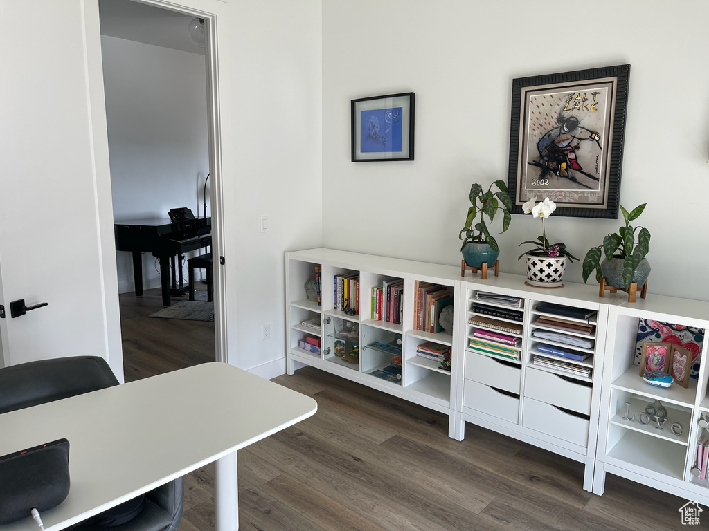 Office area featuring dark wood-style flooring