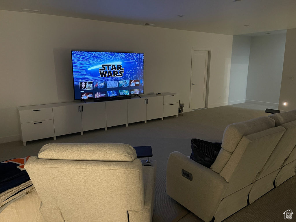 Carpeted living room with baseboards
