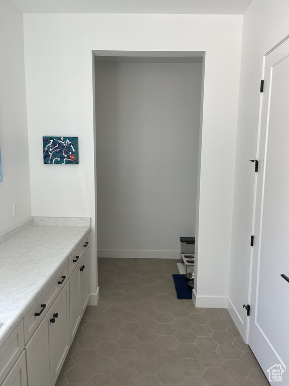 Laundry room featuring baseboards