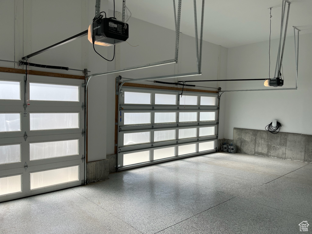 Garage featuring a garage door opener