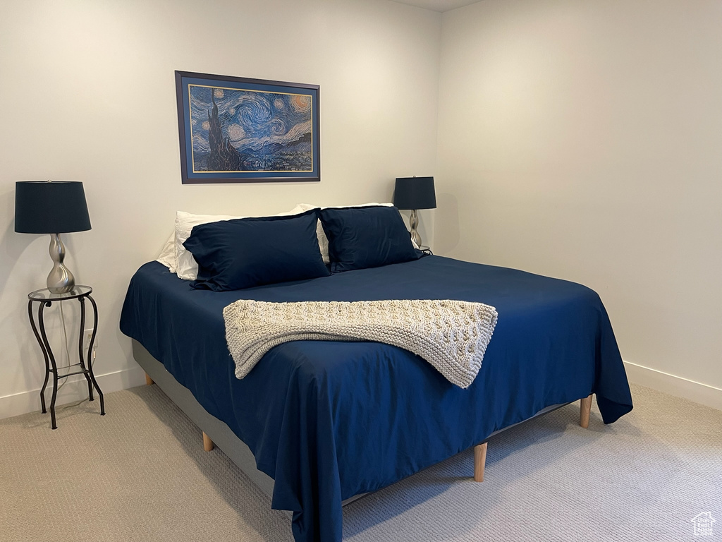 Carpeted bedroom with baseboards