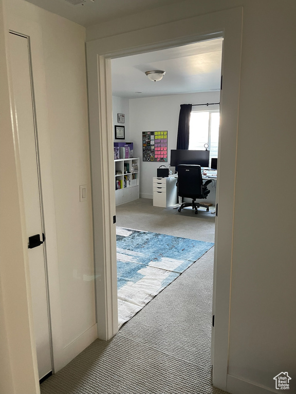 Corridor with carpet flooring